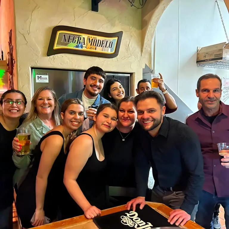El Jardin team celebrating inside the restaurant